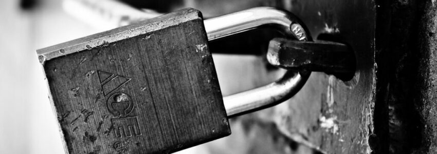 A padlock to a prison cell used during lock down.