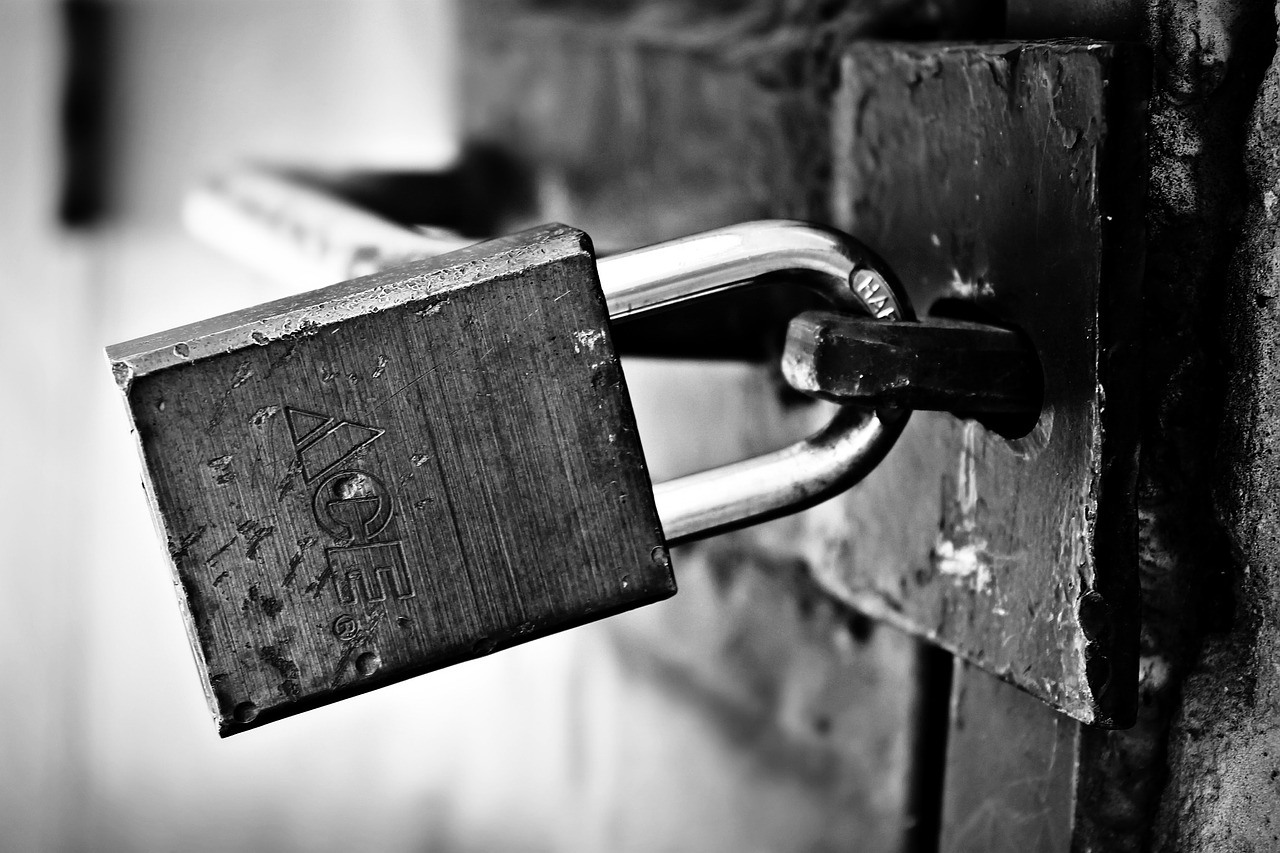 A padlock to a prison cell used during lock down.