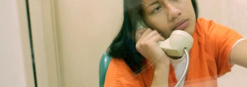 An inmate calling her family.