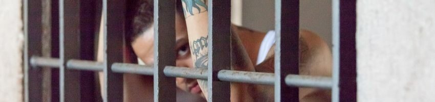 An addict dealing with withdrawal symptoms while inside jail