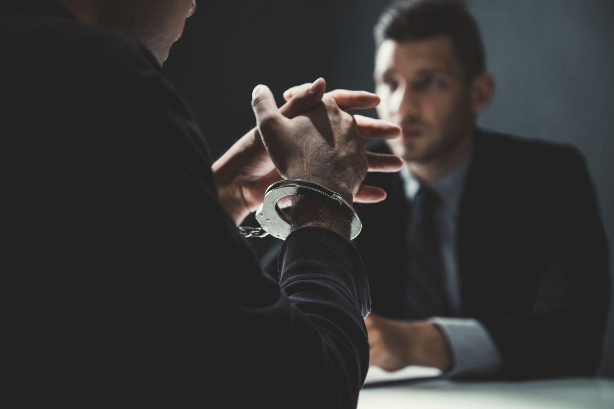 An inmate talking to a prison consultant.