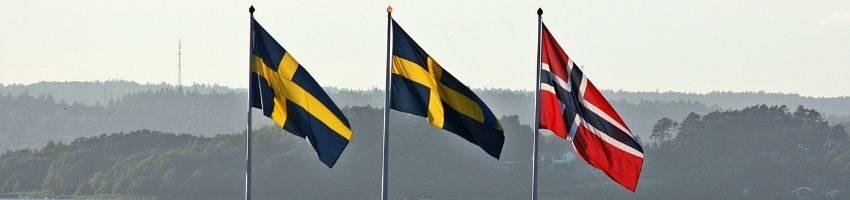 Flags of Sweden and Denmark, two nordic countries with cushy prisons.