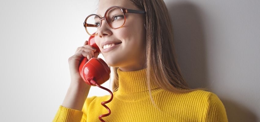 A woman wondering how to accept calls from jail for free.