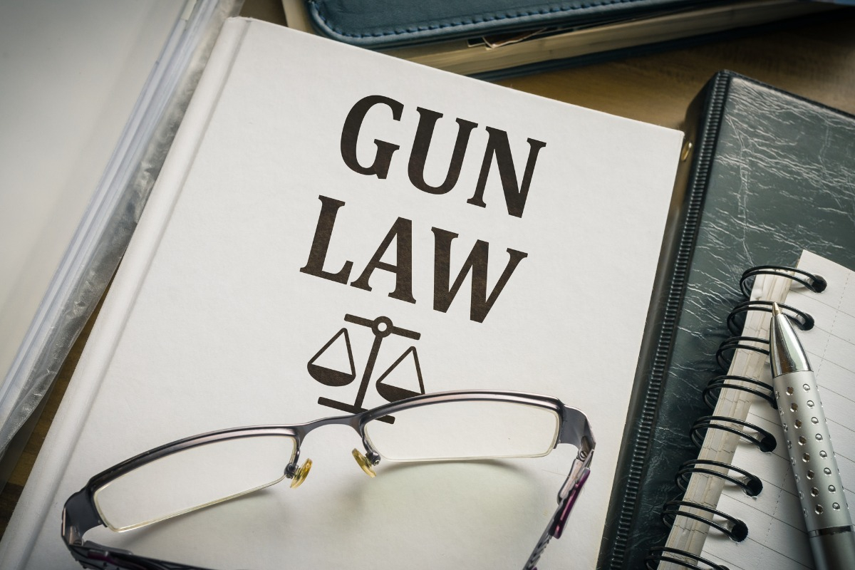 A law book containing the words "gun law".