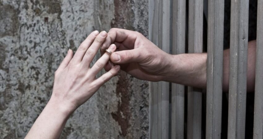 The inmate gives his lover a promise ring as a sign of his love.