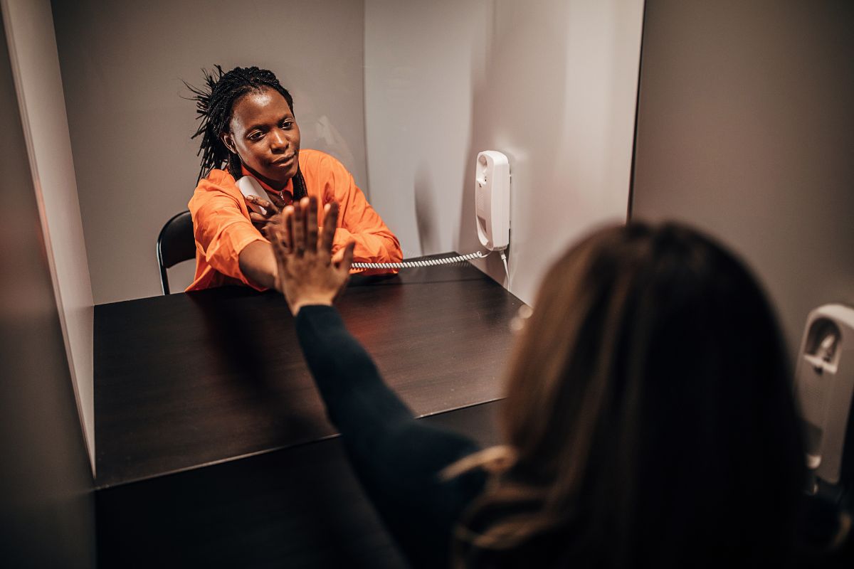 An inmate is talking to her lawyer about the benefits for spouses of incarcerated.